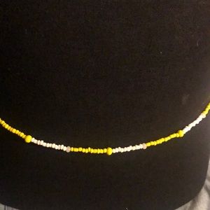 Yellow and white glass beaded belly beaded